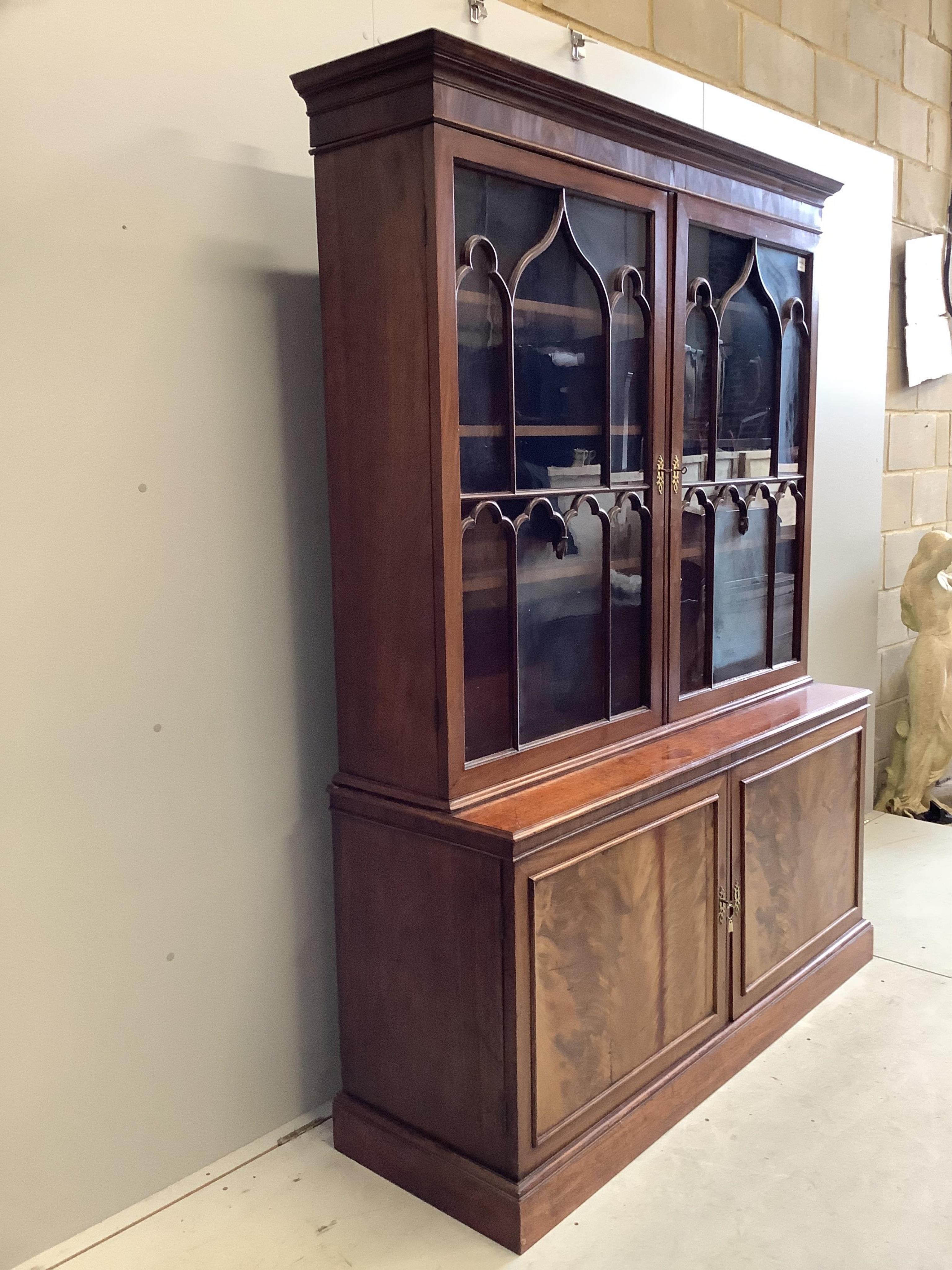 A George III mahogany bookcase, width 152cm, depth 47cm, height 203cm. Condition - fair to good